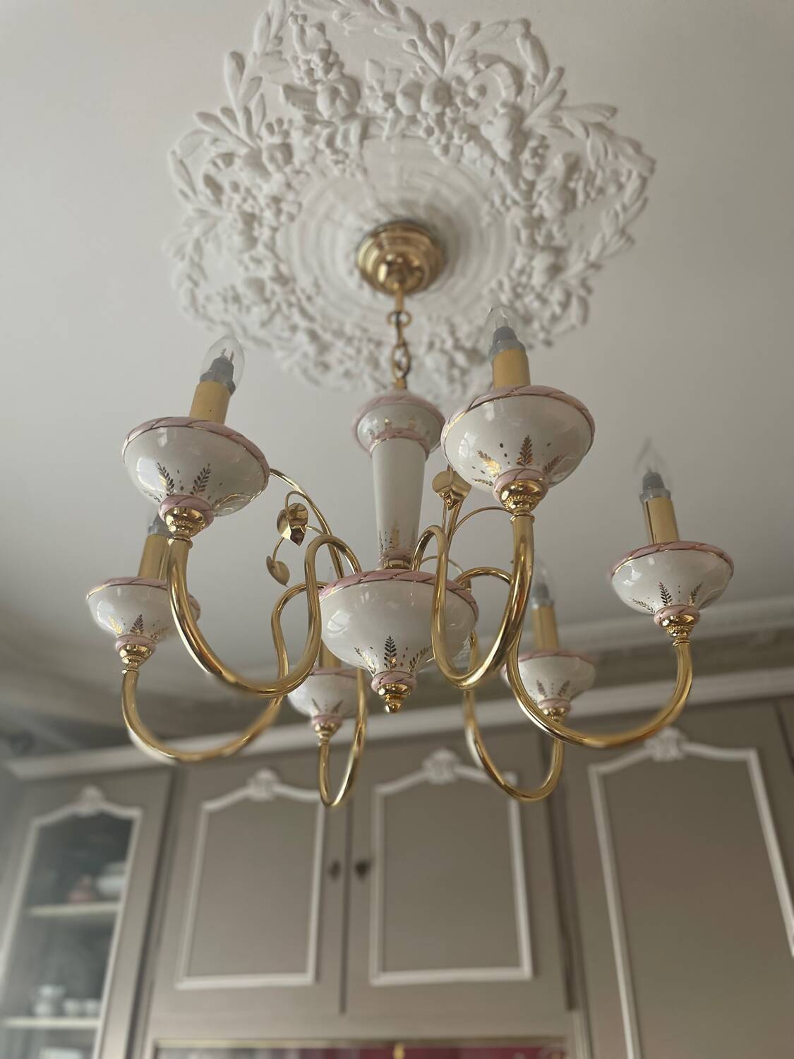 Two chandeliers and two porcelain wall lights, Italy
