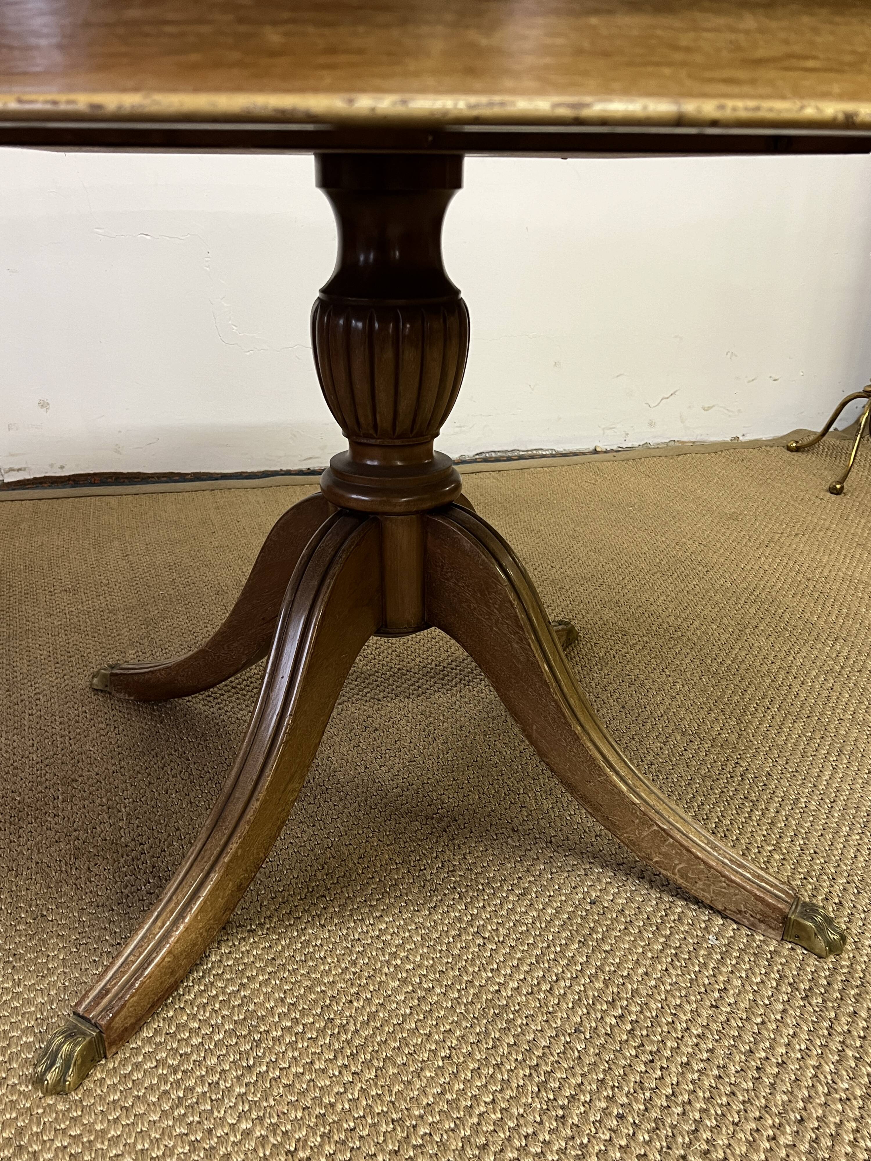 Empire style round table "Lion's Paws"