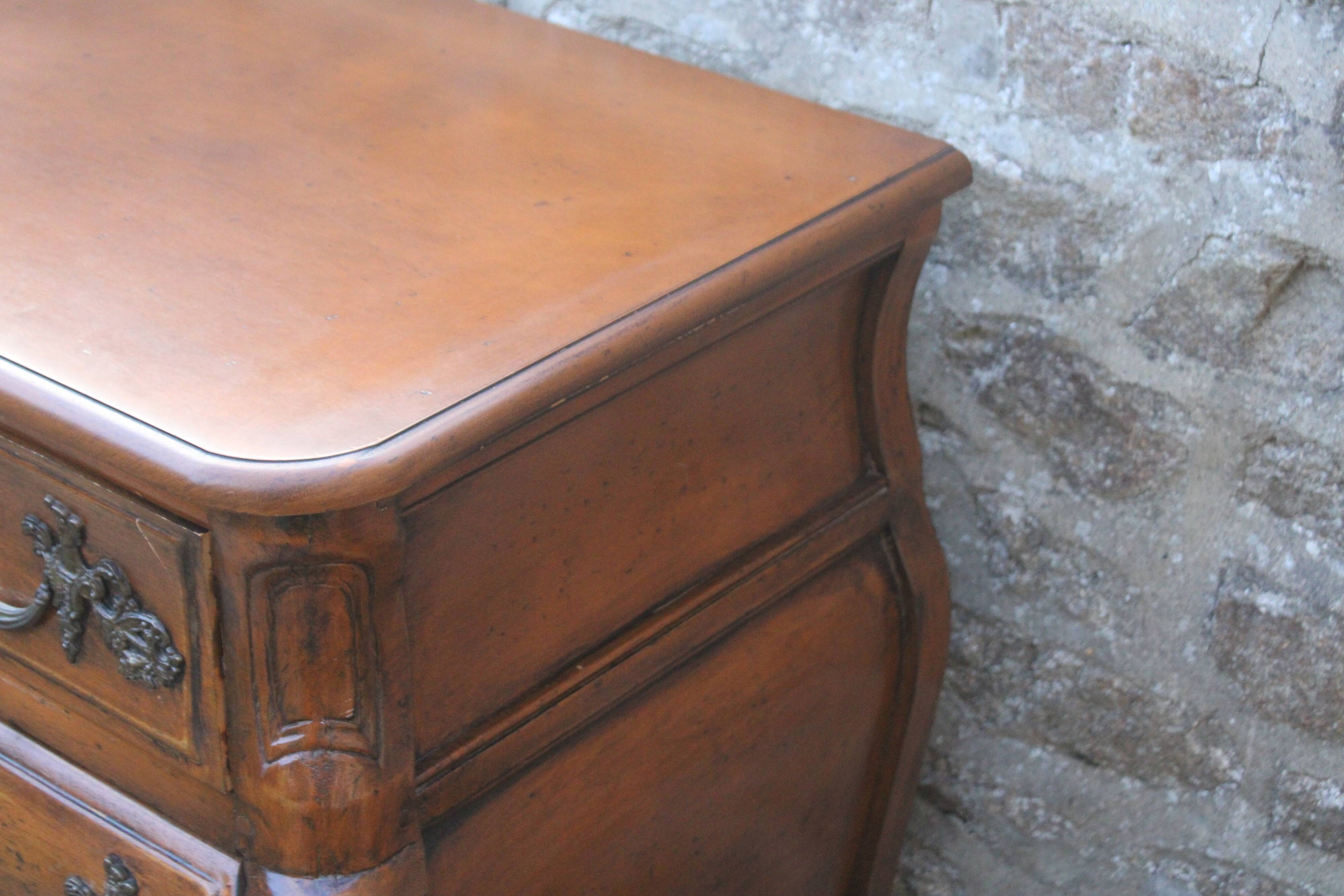 Curved Louis XV style chest of drawers known as a “tomb”
