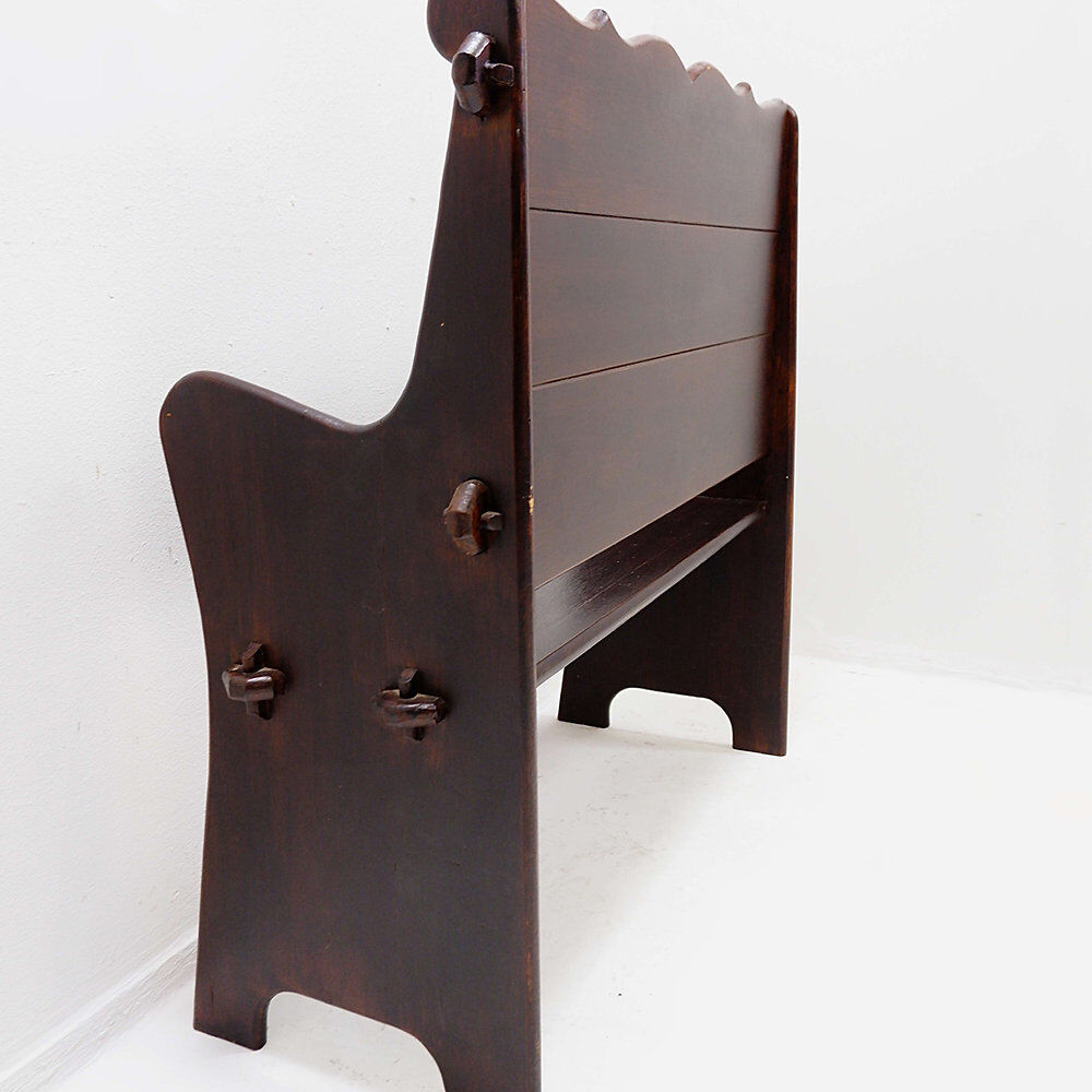Vintage solid wood church bench from the 20th century.