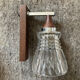 Pair of 60s teak and molded glass sconces