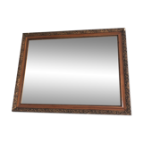 Old mirror with wooden frame and plaster moldings