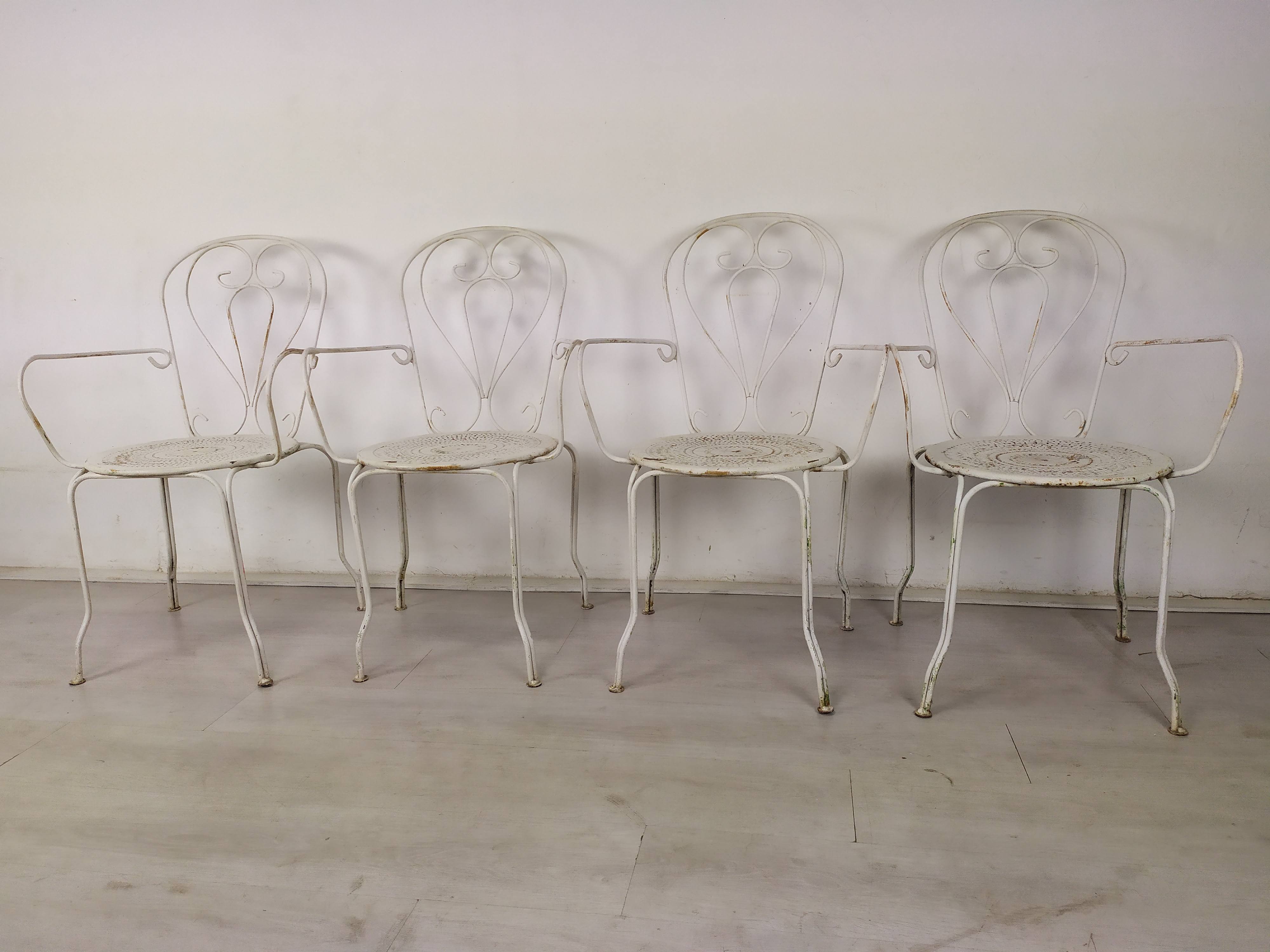 4 wrought iron garden armchairs