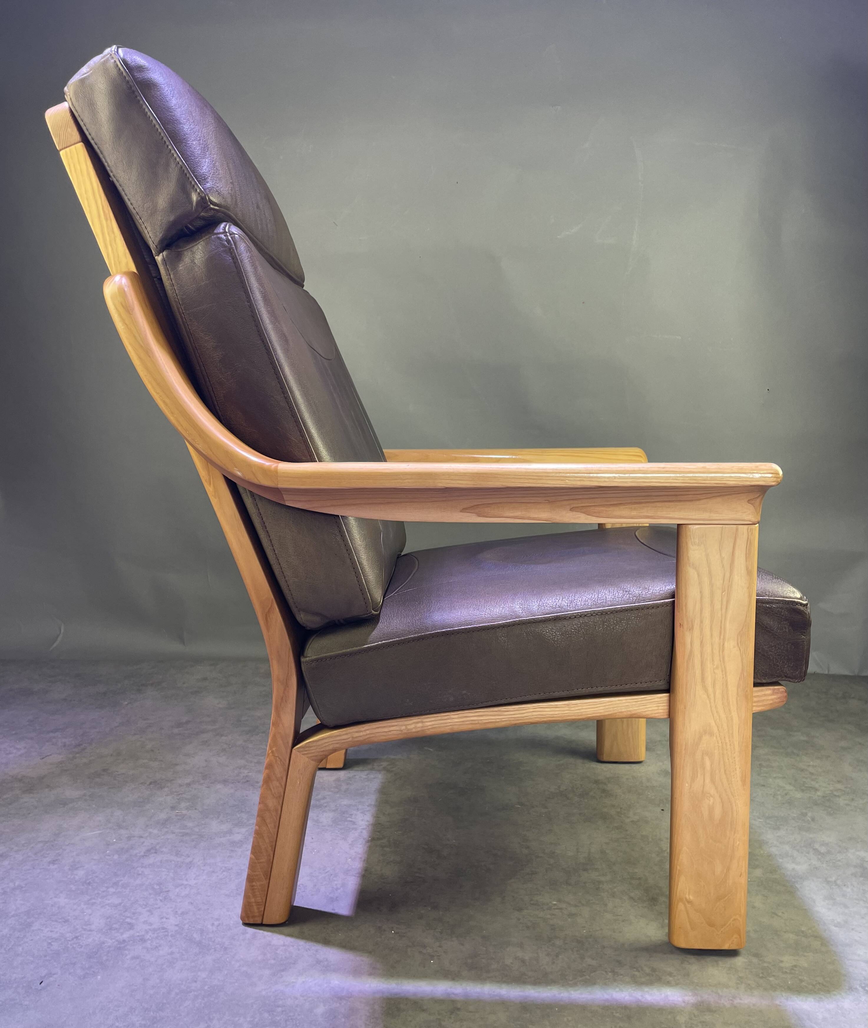 Chocolate leather armchair, wooden structure