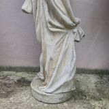 Antique reconstituted stone planter depicting a cherub