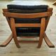 Scandinavian armchair in wood and leather.