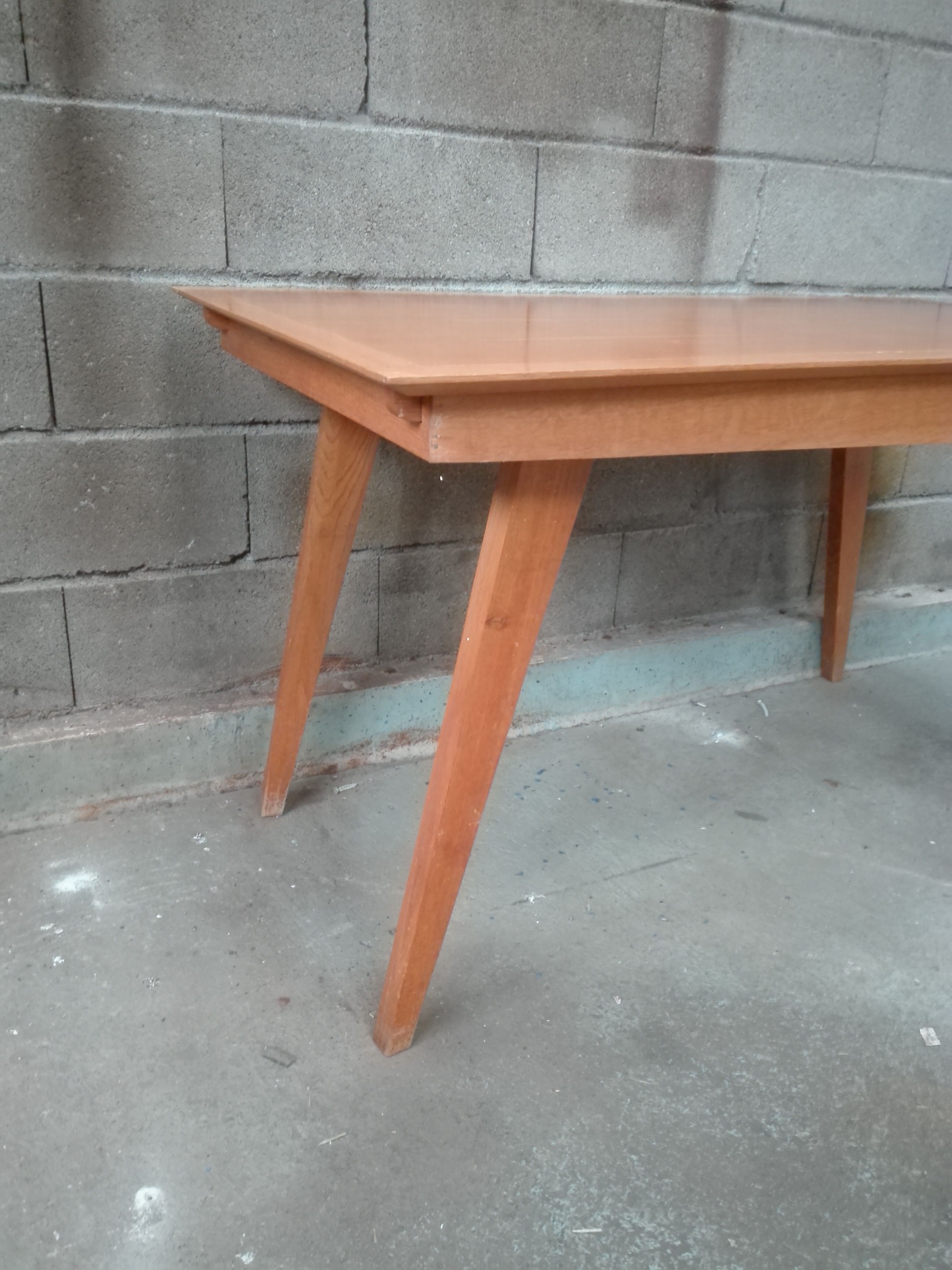 Dining table with compass feet