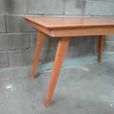 Dining table with compass feet