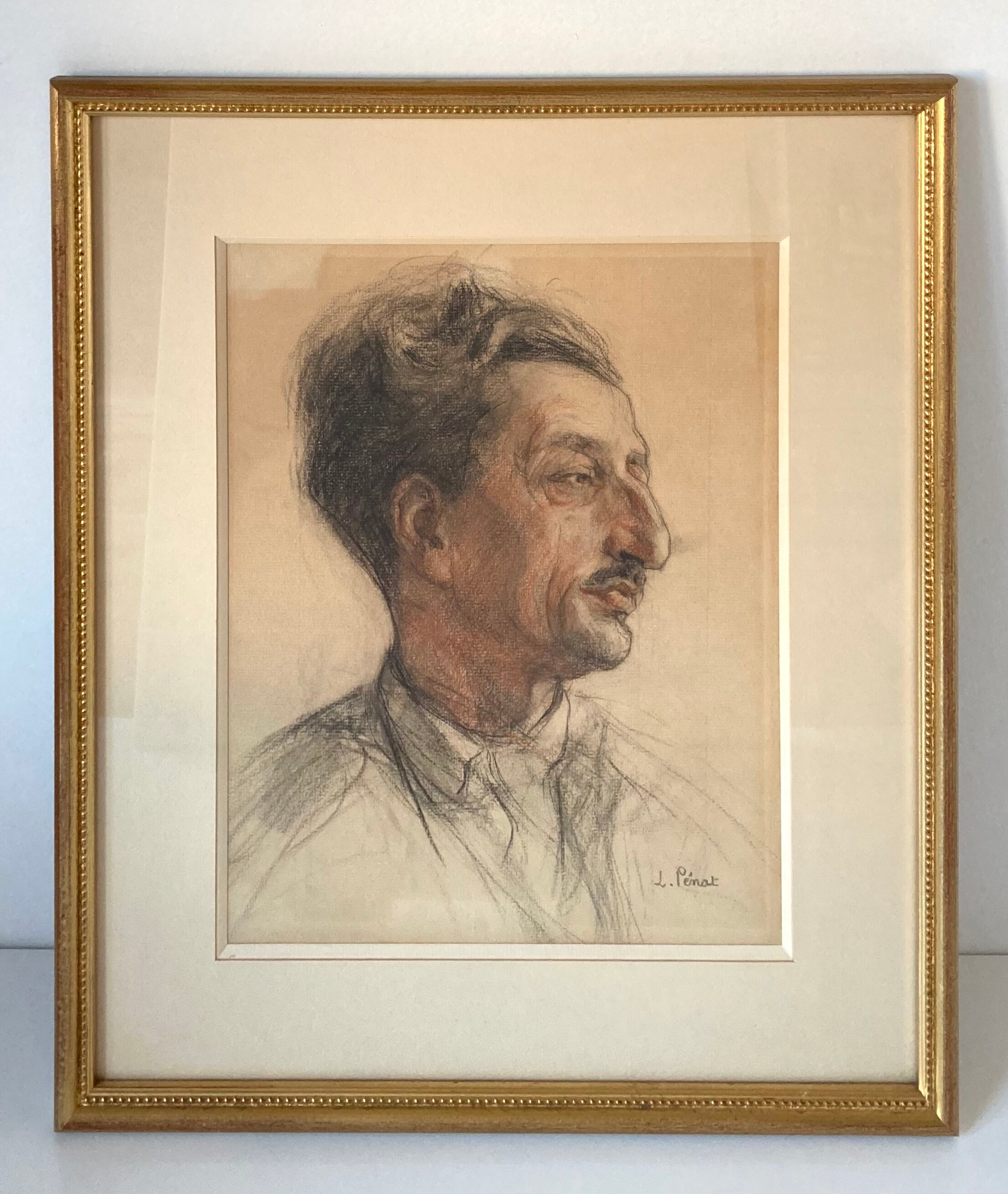 Portrait of a man with charcoal and sanguine of 1953 signed Lucien Pénat