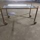 Rolling coffee table in vintage gilded bronze