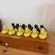Box of 12 dog-shaped cutlery rests in yellow and black majolica.