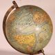 Small terrestrial globe by J. Forest, published by Girard & Barrière, early 20th century