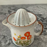 Vintage stoneware jug and its citrus juicer.