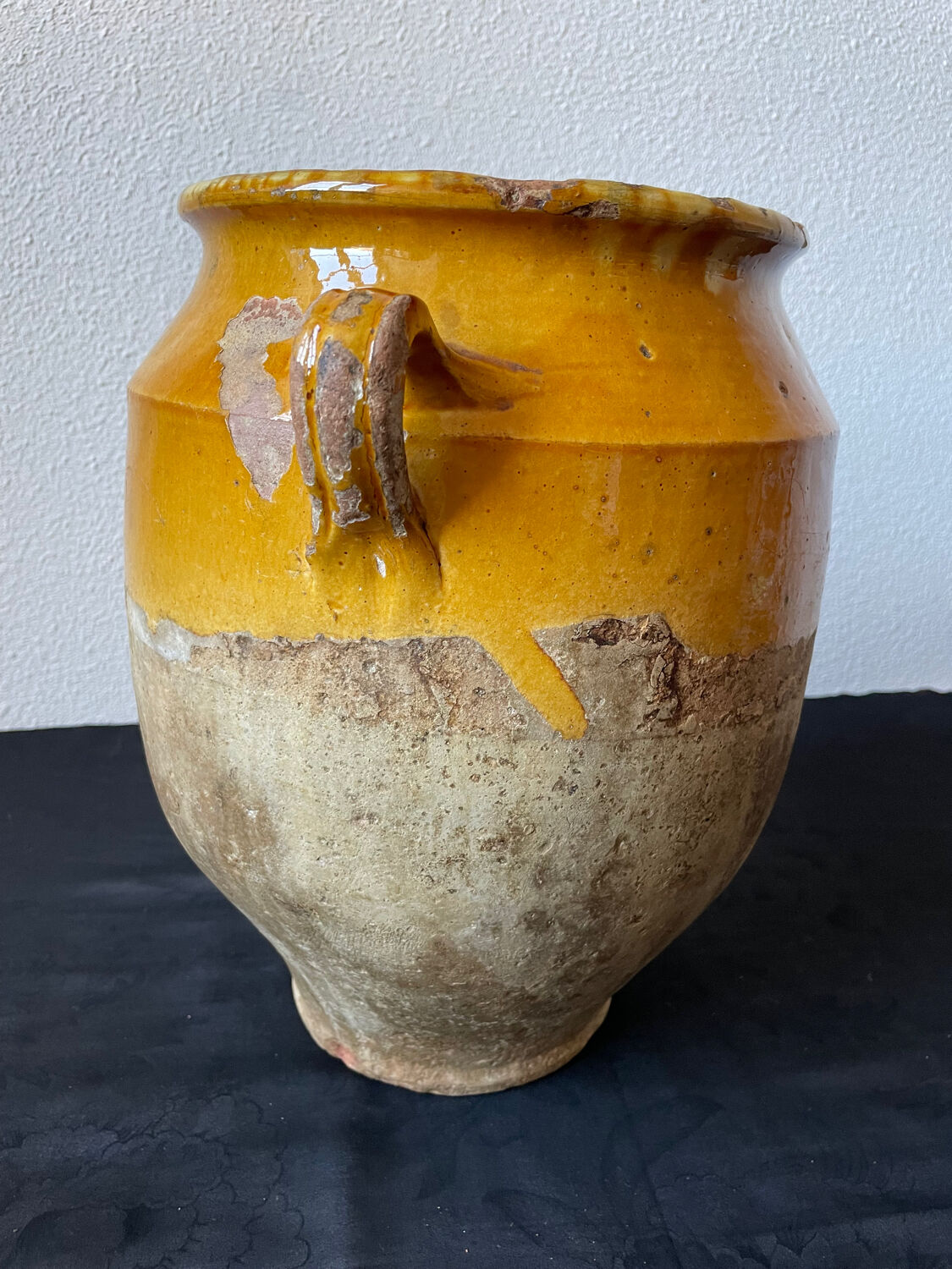 Old yellow glazed terracotta grease pot south west France