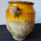 Old yellow glazed terracotta grease pot south west France