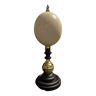 Ostrich egg Struthio camelus on pedestal