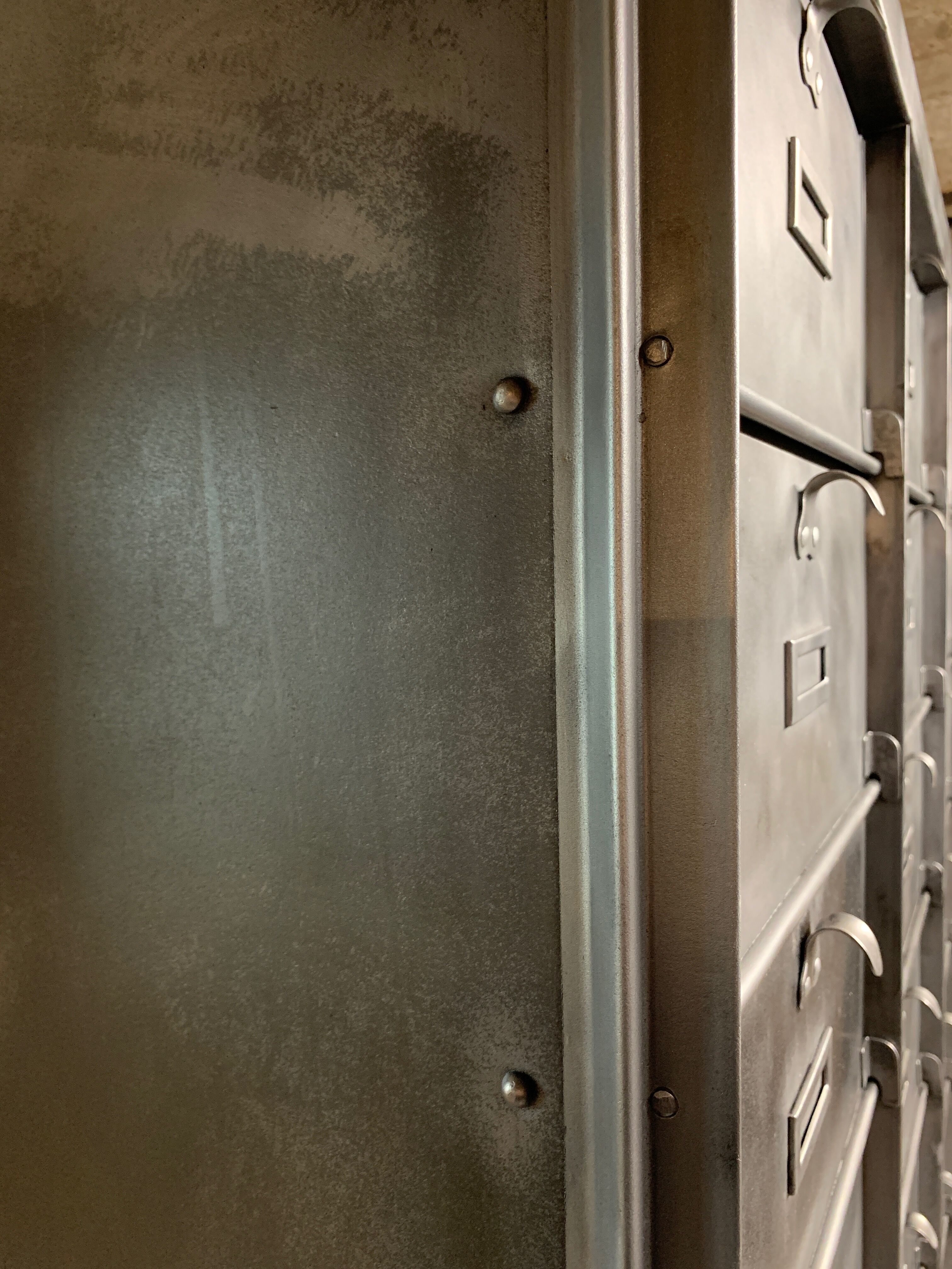 Industrial cladding furniture in brushed and patinated steel
