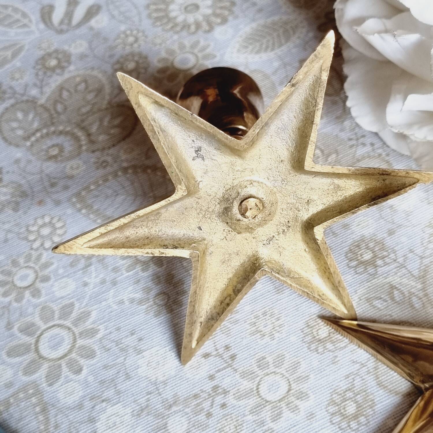 Duo of brass star candlesticks