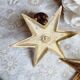 Duo of brass star candlesticks