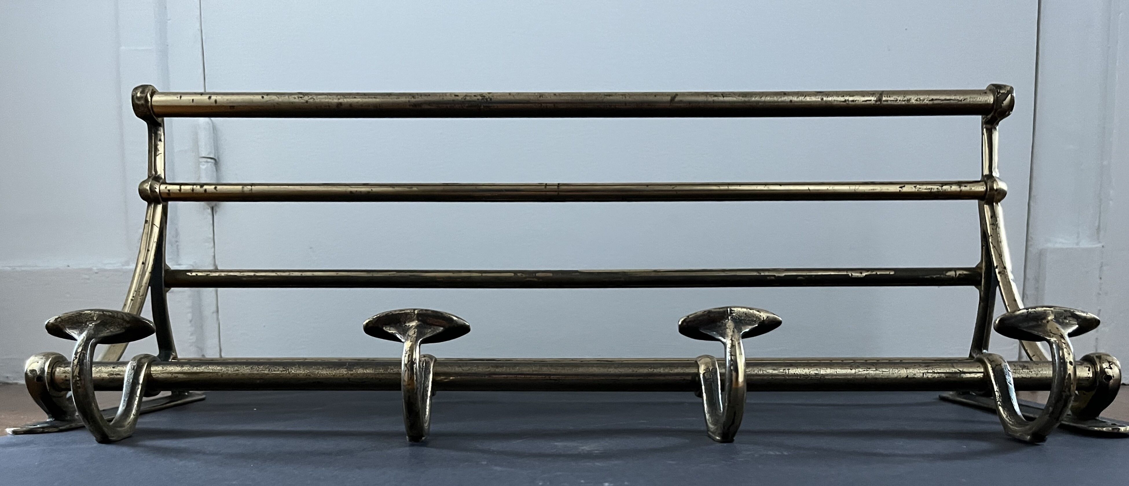 Antique coat rack in gilded metal