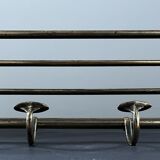 Antique coat rack in gilded metal