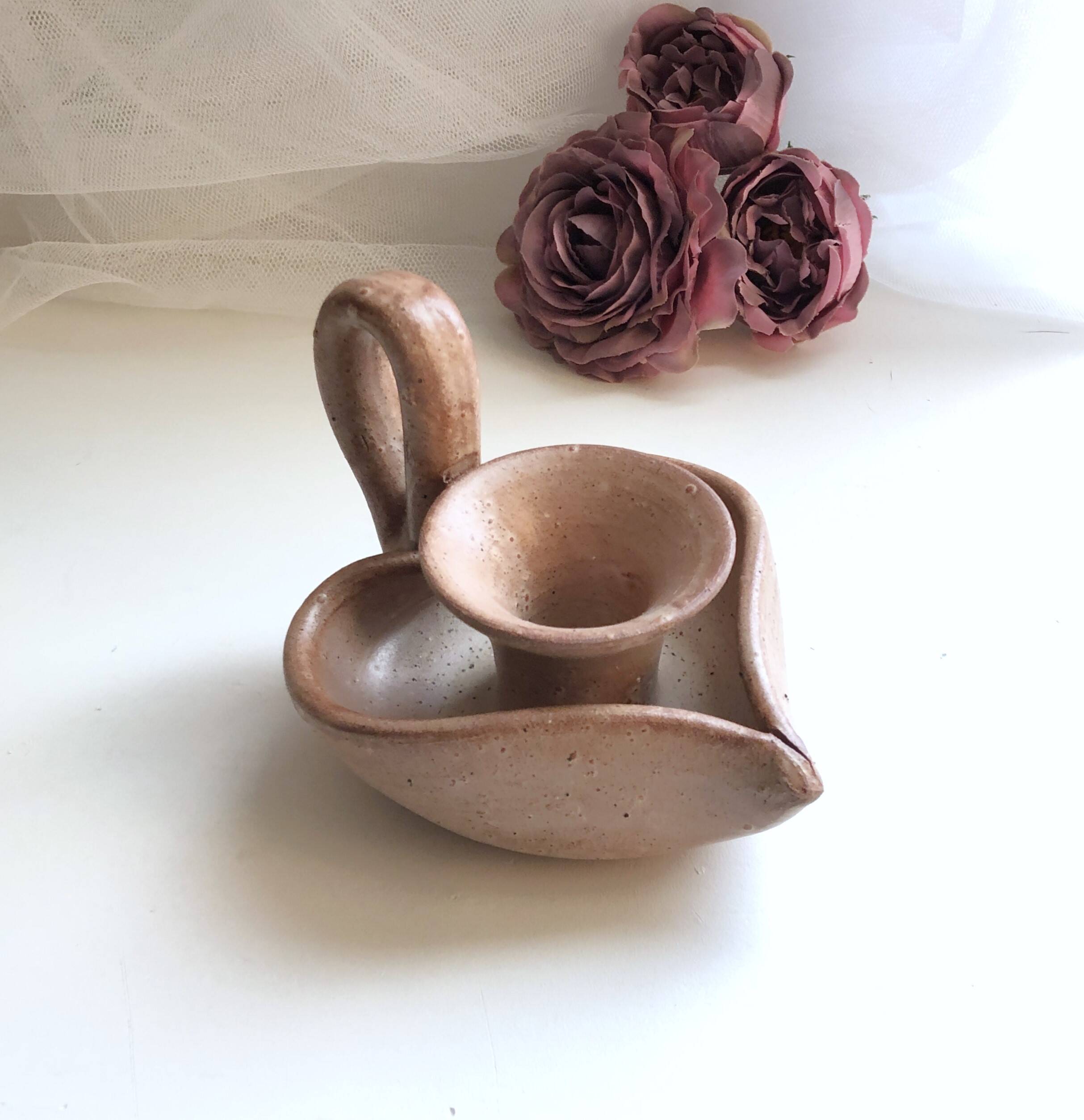 Glazed stoneware heart-shaped hand candle holder