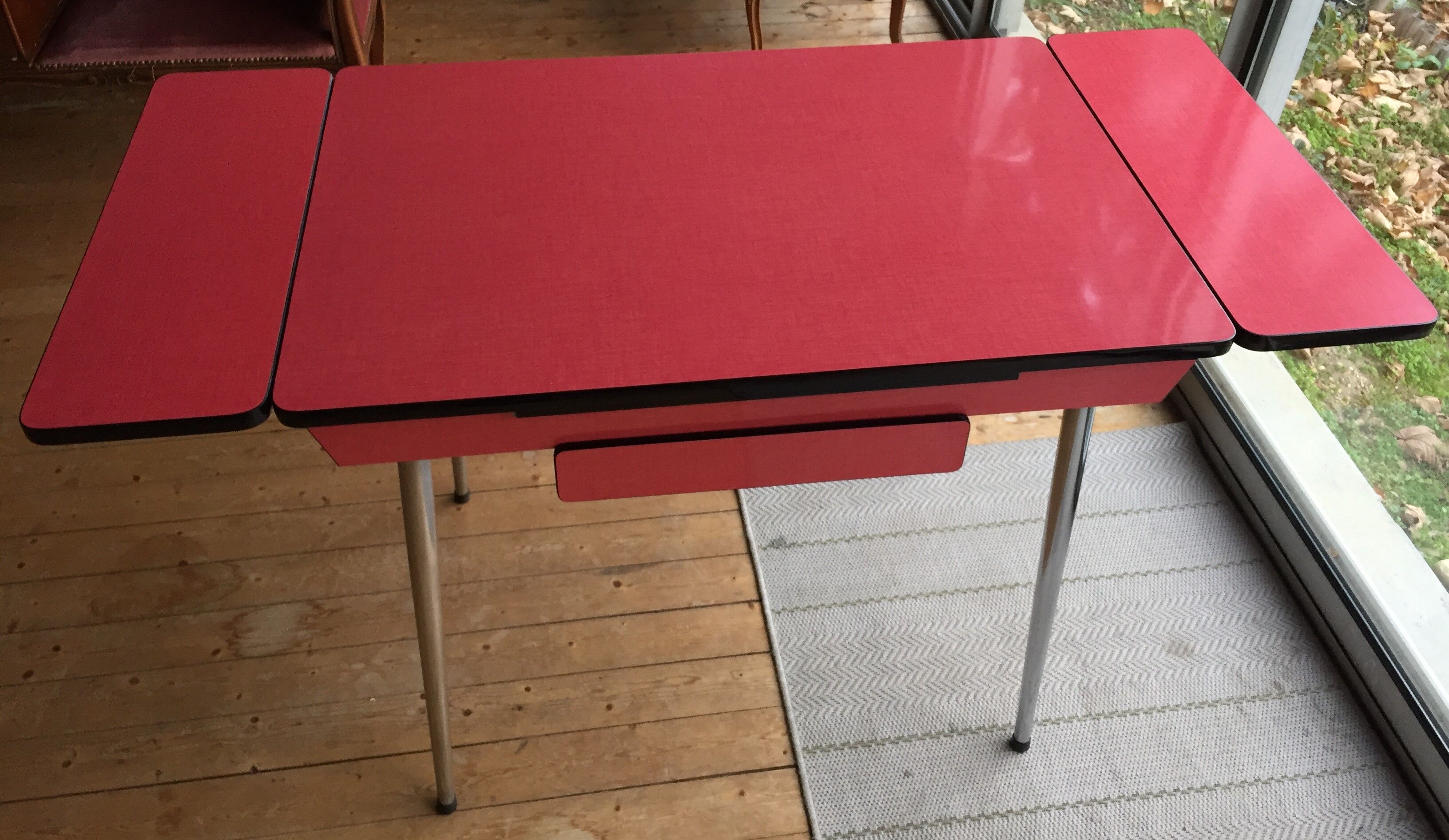 Table set and 2 vintage vintage pale red formica chairs