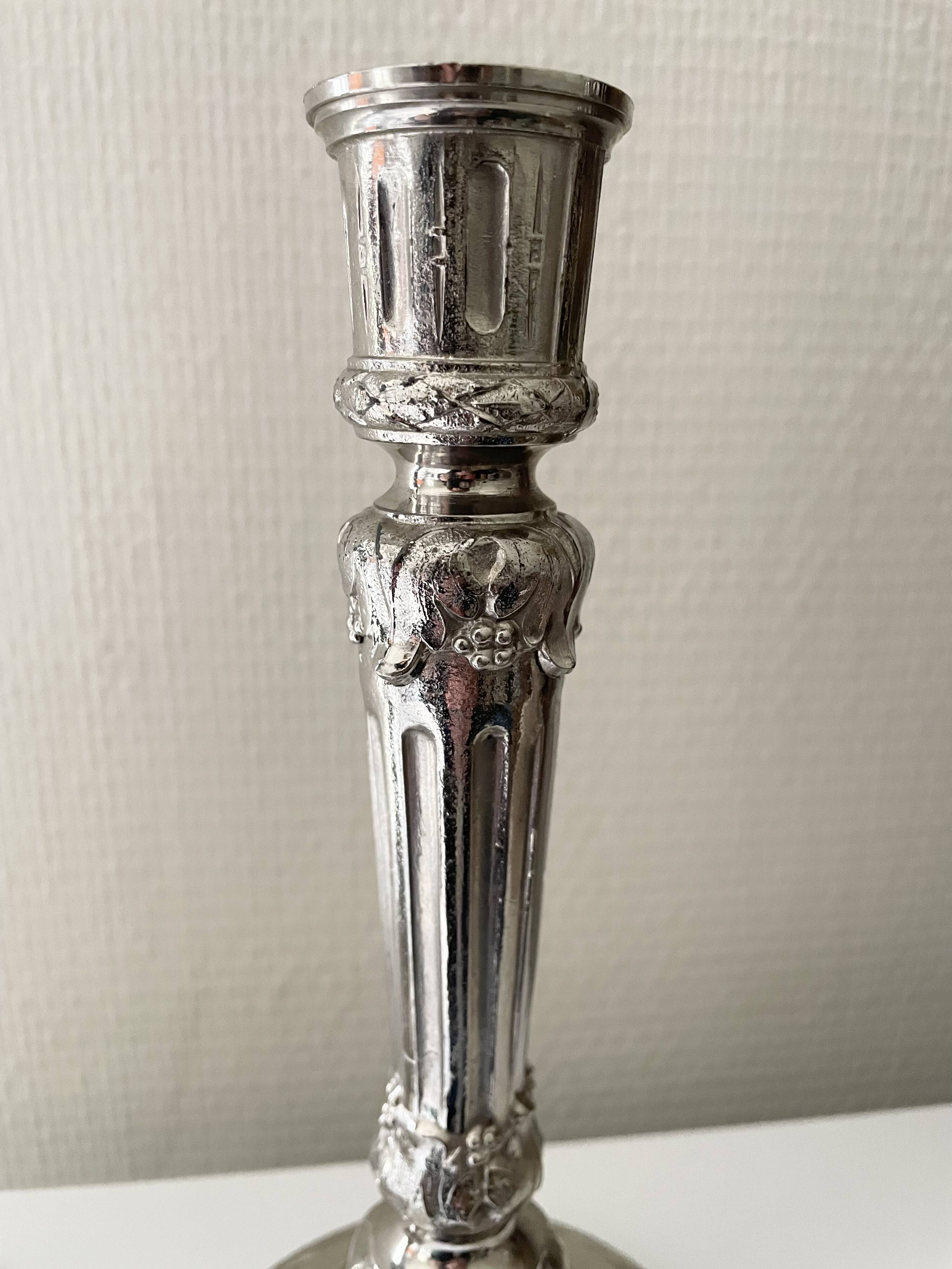 Antique silver-plated candlesticks in classic style