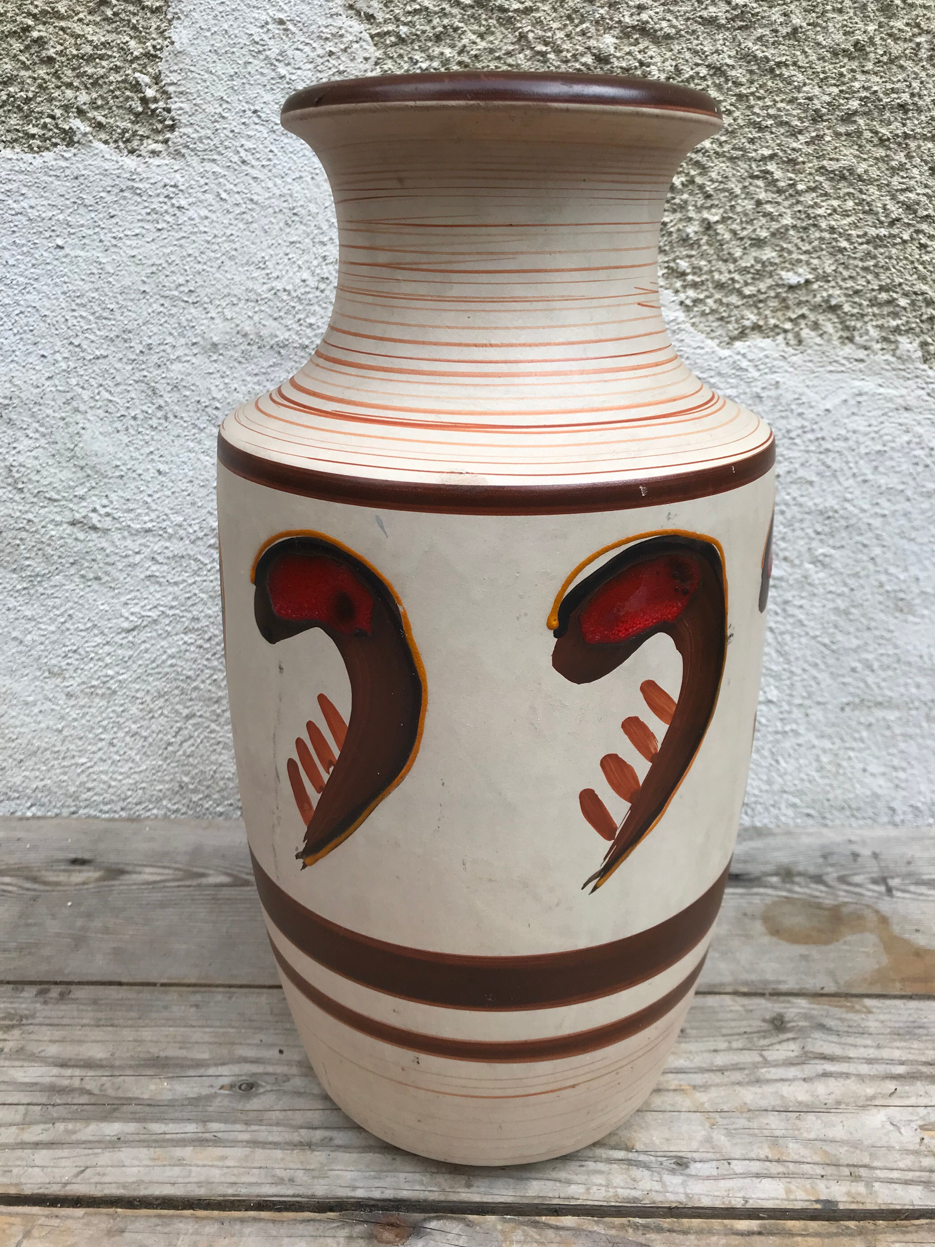 Antique beige ceramic vase with decorative painting