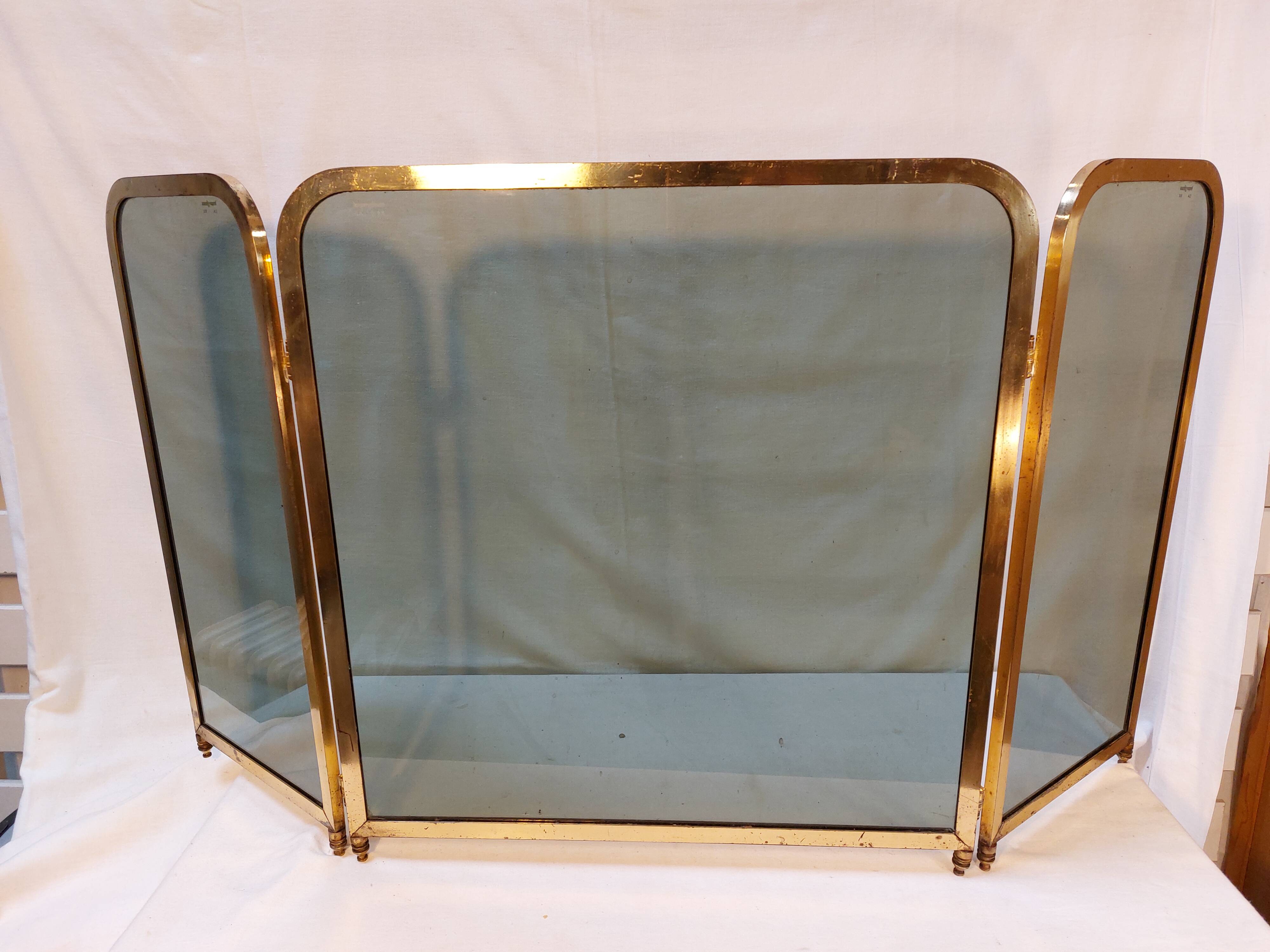 Vintage fireplace screen in smoked glass and gold-tone metal
