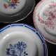 A set of 4 flat plates in pink and blue with Fontanges flowers from Sarreguemines.