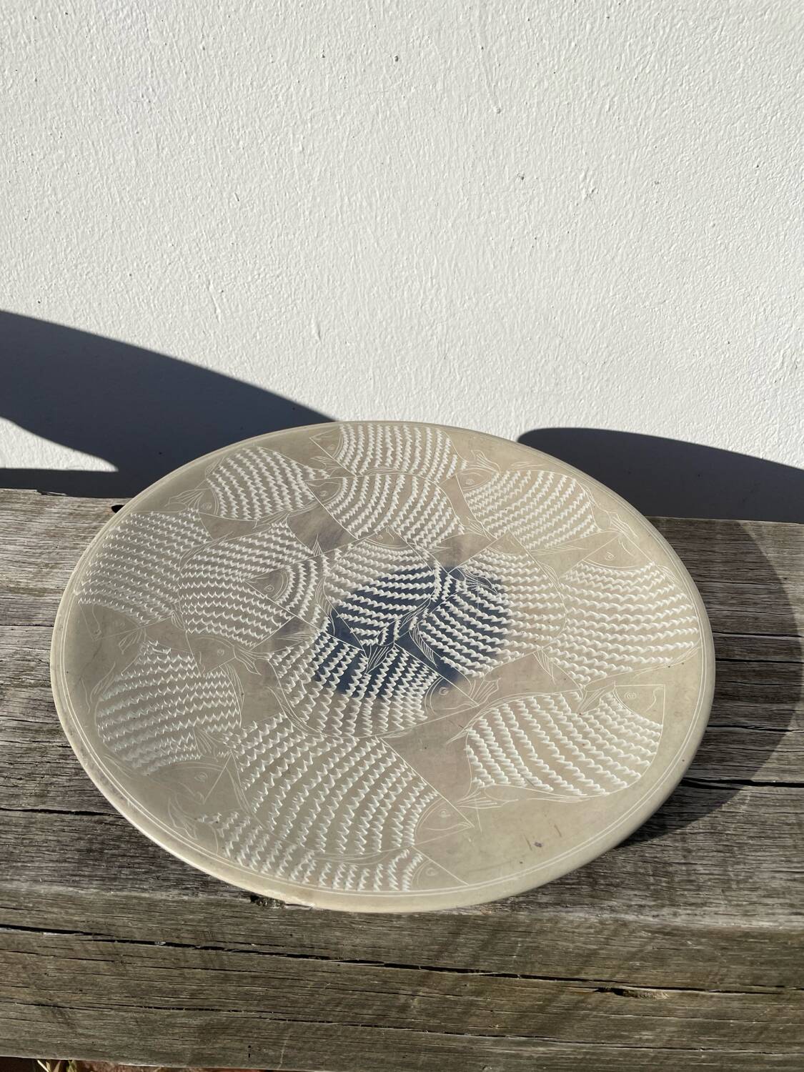 Ethnic handmade round fish dish