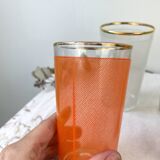6 colorful juice glasses in their vintage basket