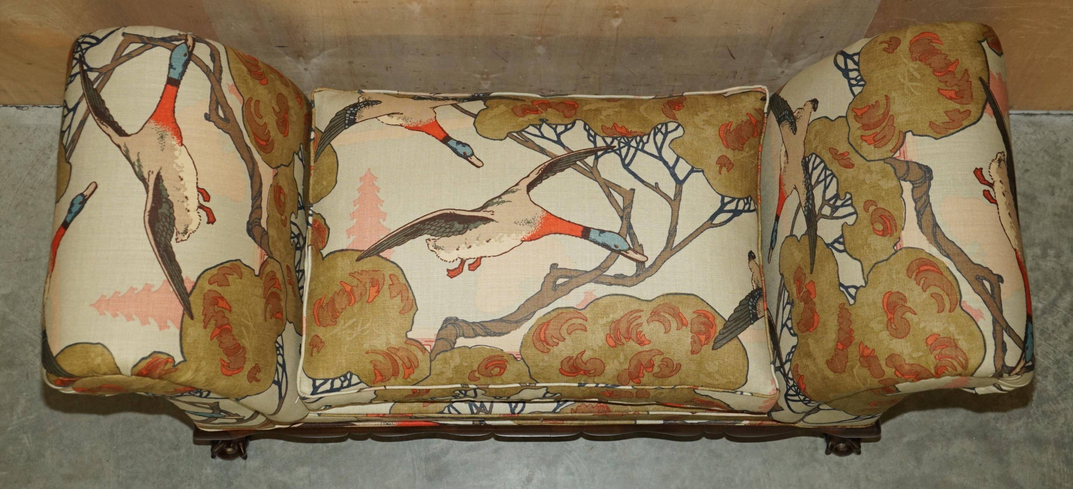 Antique banquette with cluster and ball feet, window seat in Mulberry Flying Ducks fabric.