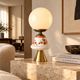 Carrie — Table lamp in white opal, floral ceramic and gilded brass.