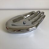 Empty silver chromed ceramic pocket in the shape of a large hand, 1980