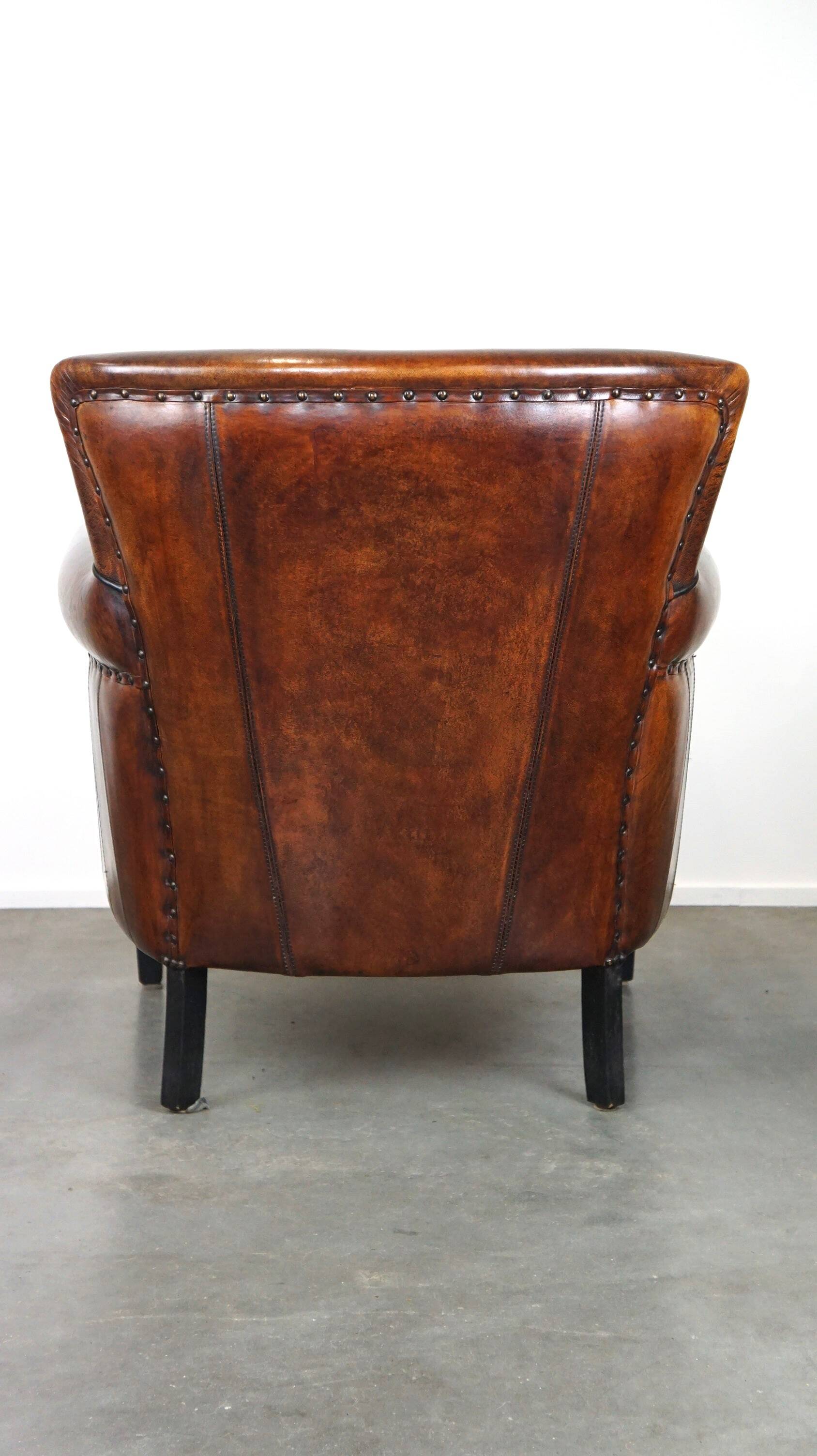 Stylish sheepskin leather armchair with a refined appearance