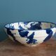 Empty pocket bowl in terracotta, glazed with "ink spots" design.