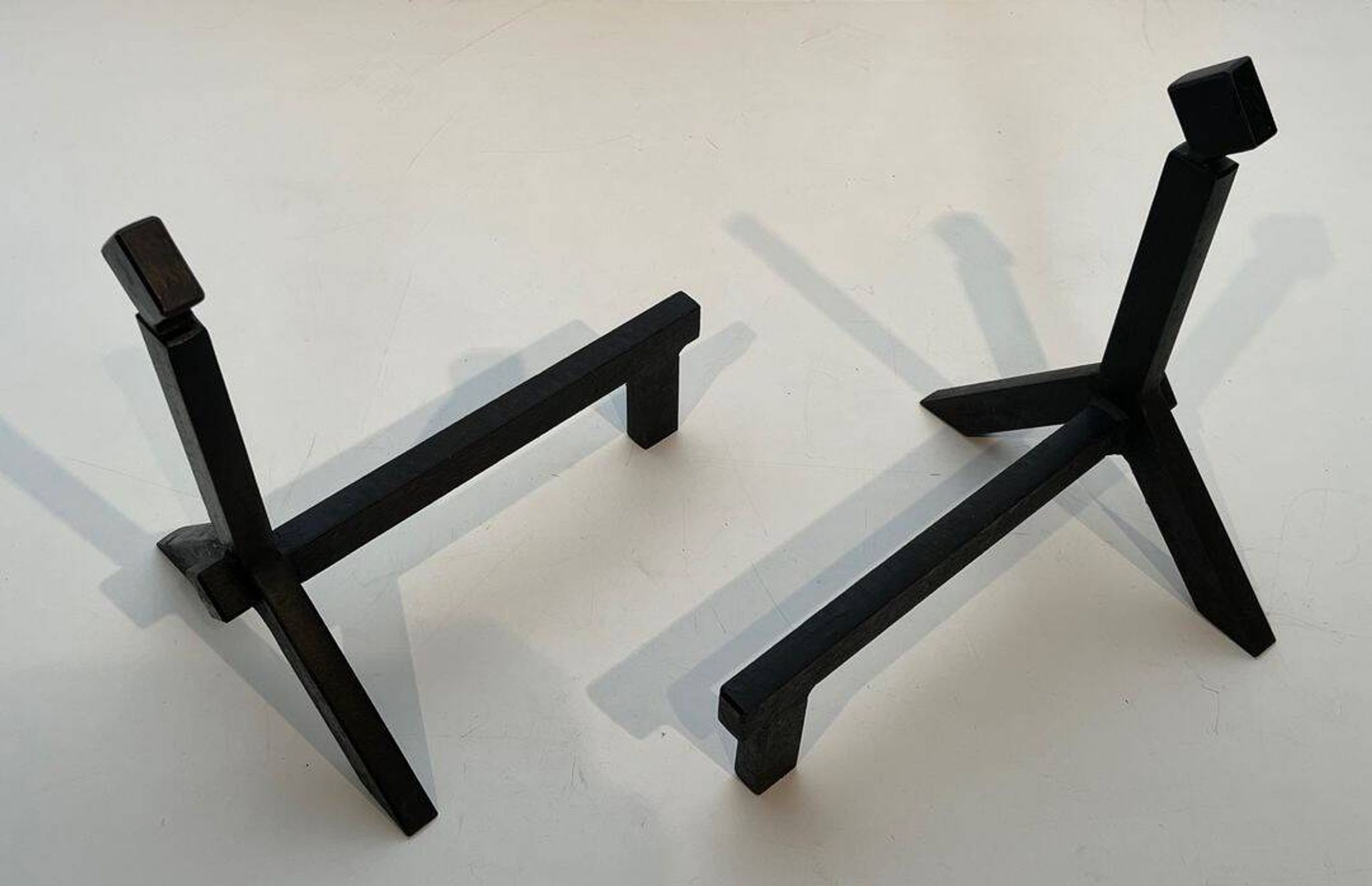 Pair of Modernist Black Iron Andirons with Diamond Finials and Angled Bases