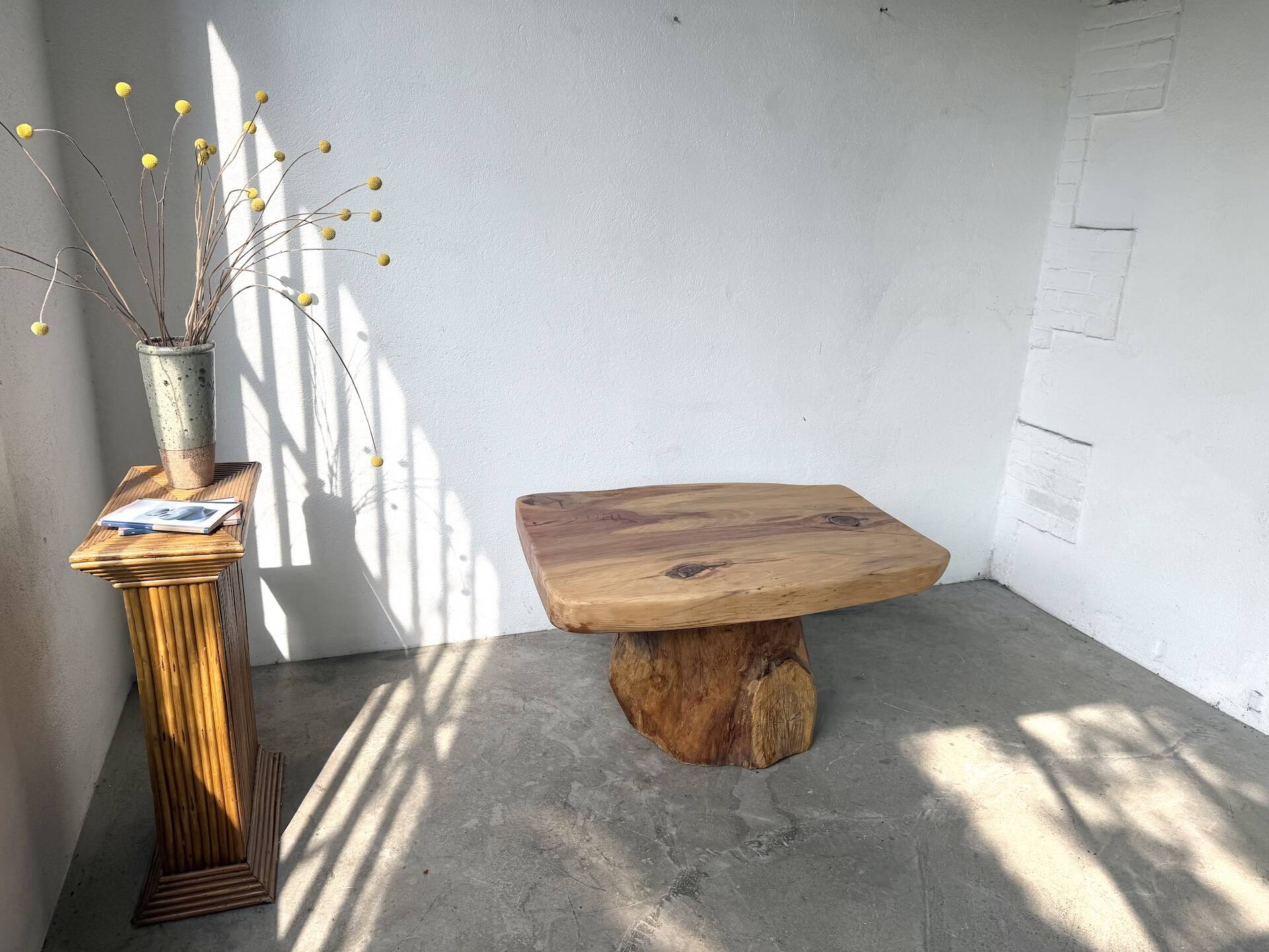 Organic brutalist coffee table in solid cedar, trunk pedestal, 1970s.