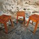Set of 3 vintage French wooden stools from the 1950s.