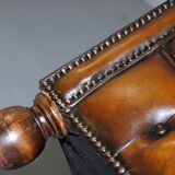 Restored vintage leather Chesterfield canapé in Thomas Chippendale style.