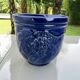 Wall pot in glazed blue terracotta with a grape design, 1970s.
