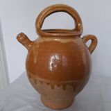Old enameled ceramic pitcher