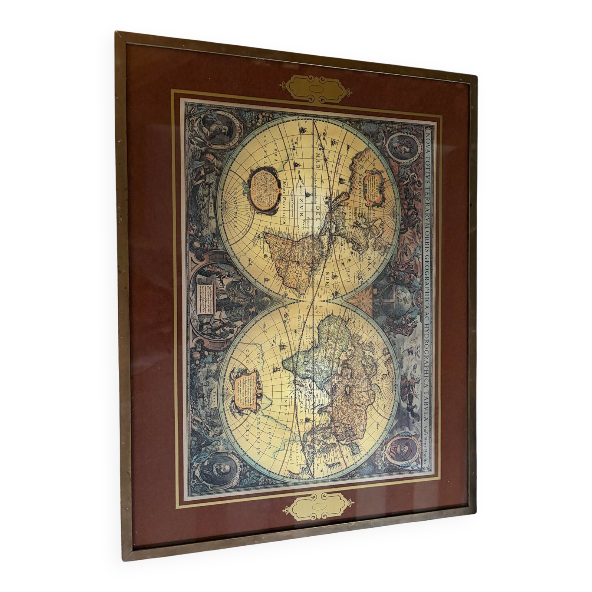 Wood and brass coffee table with a world map under glass.
