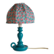 Small old candlestick lamp with hand-stitched flowered lampshade