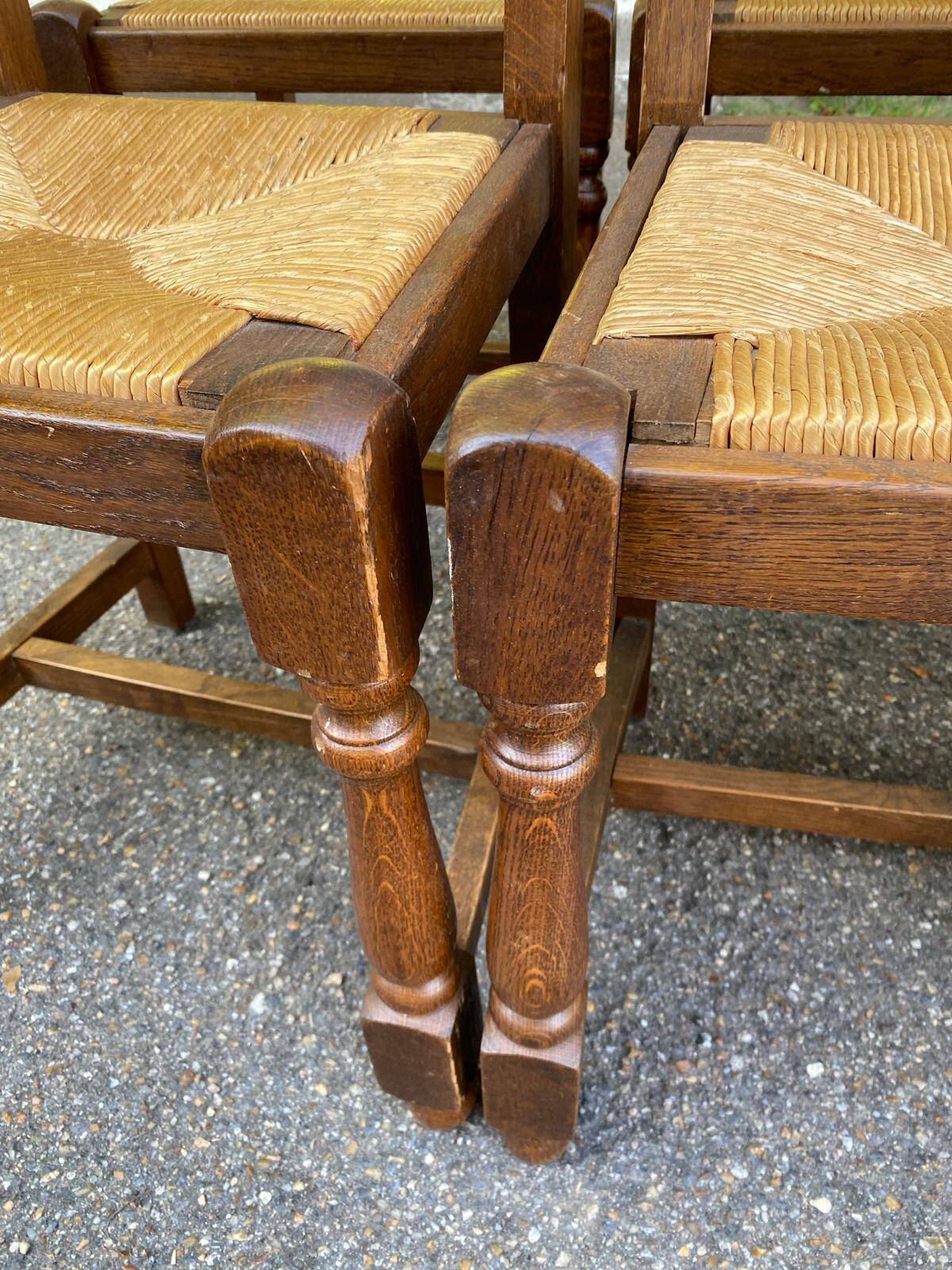 8 solid oak chairs in medium oak with straw, farmhouse style, high back.