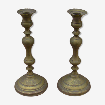 Pair of candle holders with oriental decoration