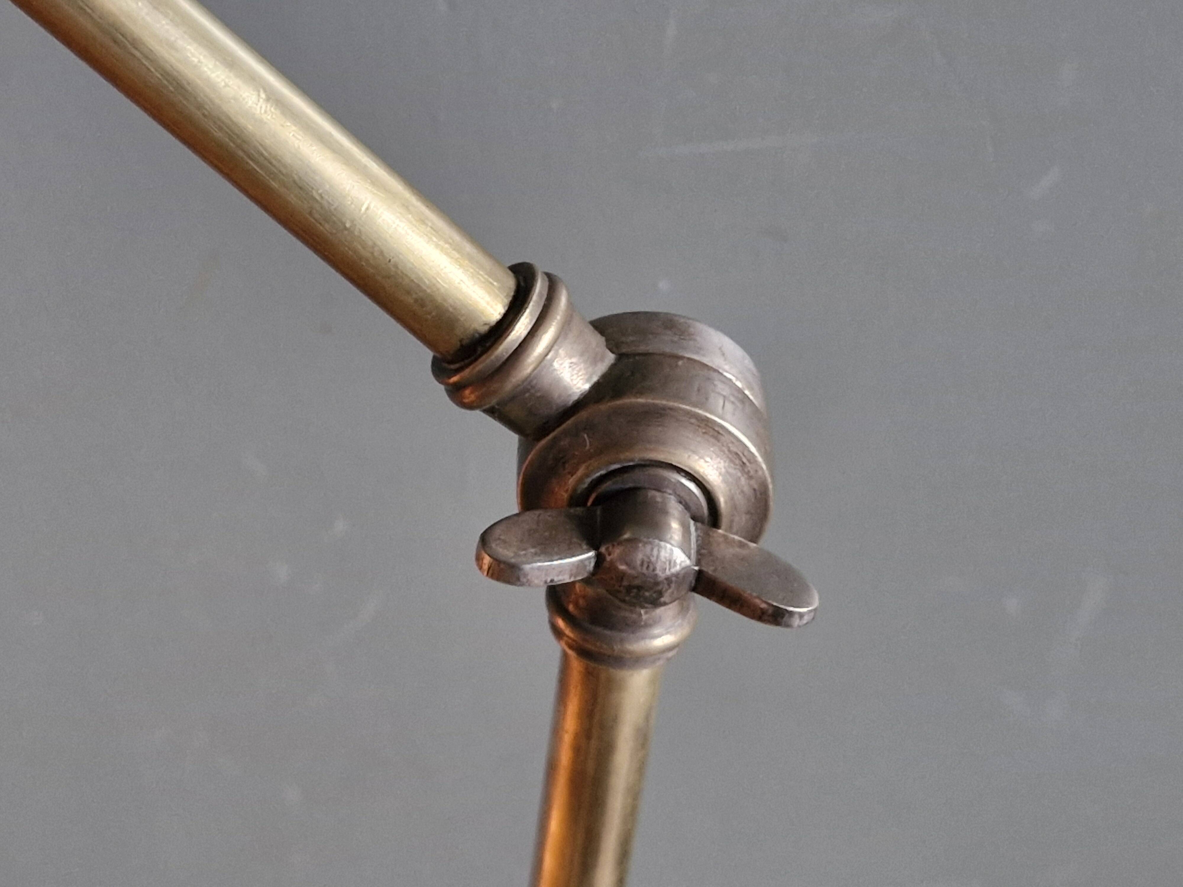 Old adjustable industrial lamp in bronze with 2 arms.