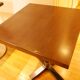 Restaurant table in solid beech central column with polished brass ring